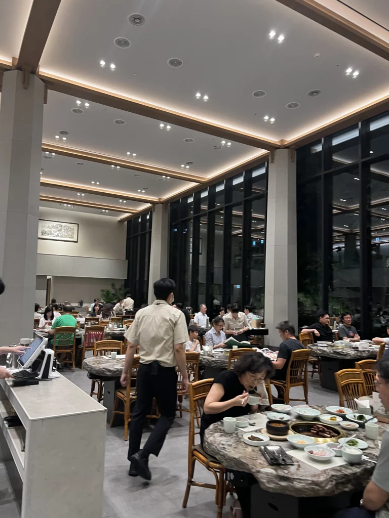 Modern dining room interior at Samwon Garden Seoul featuring elegant ceiling design and spacious seating for premium Hanwoo galbi Korean BBQ experience in Gangnam.
