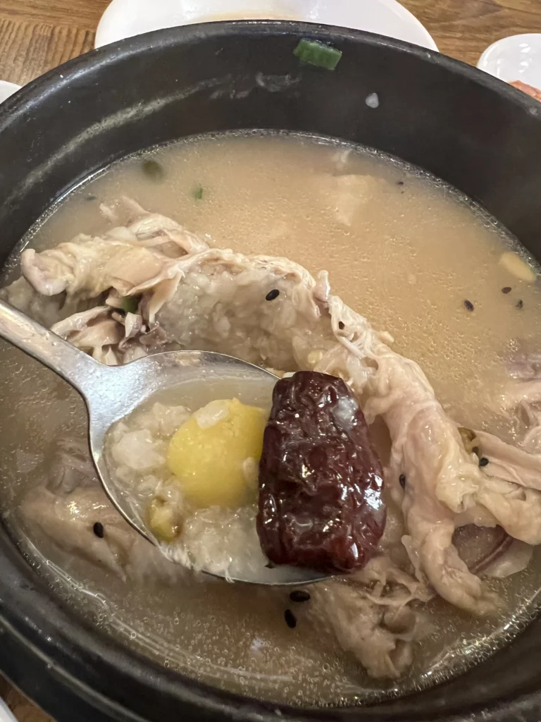 Glutinous rice and red jujube date from Tosokchon samgyetang stuffing, traditional Korean medicinal ingredients in ginseng chicken soup for wellness.