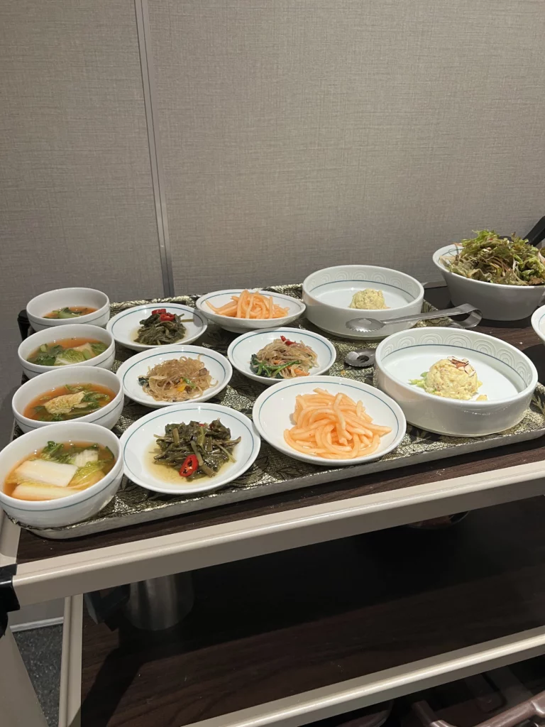 Assorted traditional Korean banchan side dishes served with pork galbi at Bongpiyang Michelin Bib Gourmand restaurant in Seoul.