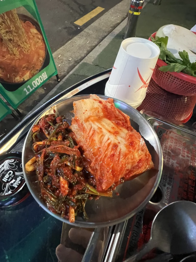 Traditional Korean banchan side dishes including kimchi served at Gimsukseoung restaurant in Seoul with 22-day aged samgyeopsal Korean BBQ.