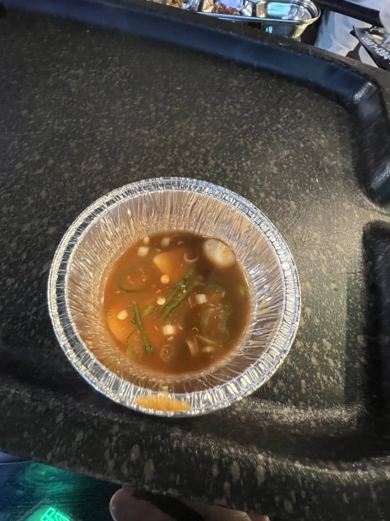 Savory Korean soup with vegetables served as a side dish at Gimsukseoung aged samgyeopsal restaurant in Seoul.