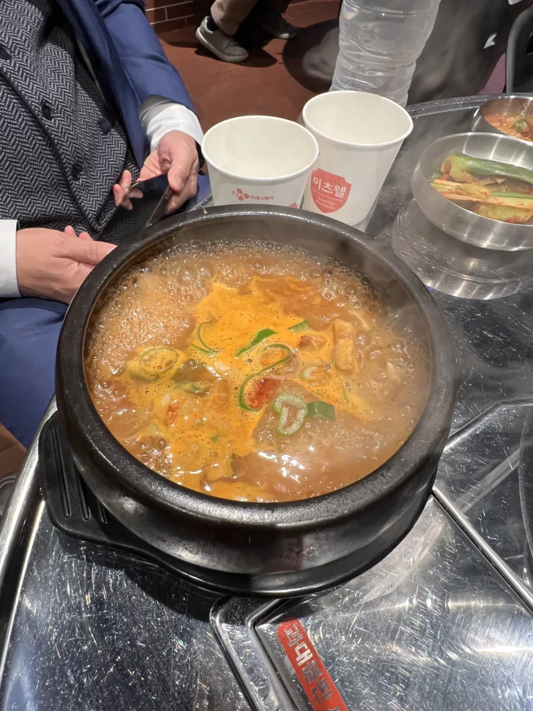 Hot bubbling Korean stew jjigae with vegetables served at Moosik samgyeopsal restaurant in Sinsa-dong Gangnam Seoul.