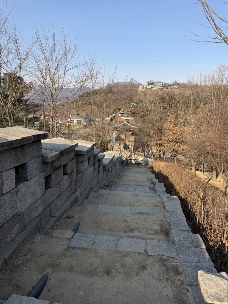 Bugaksan Mountain Seoul City Wall hiking trail near Gyeyeolsa fried chicken restaurant in Buam-dong neighborhood.
