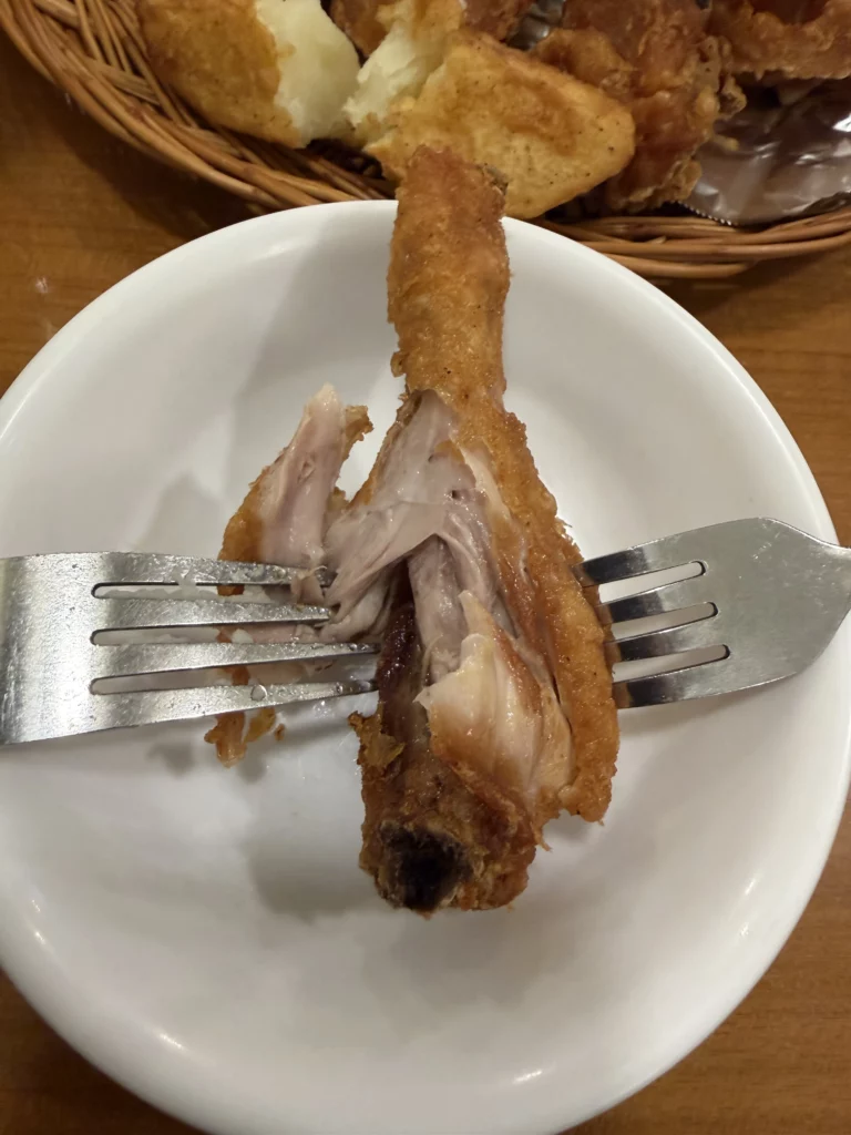Tender juicy Korean fried chicken drumstick with crispy double-fried coating at Gyeyeolsa restaurant in Seoul Buam-dong.