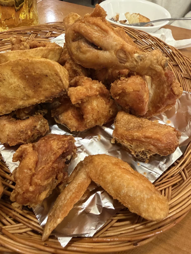 Gyeyeolsa signature double-fried Korean chicken with crispy glutinous rice flour batter and golden potato wedges served in Buam-dong Seoul.