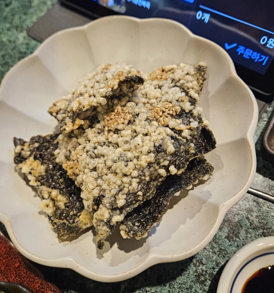 Crispy seaweed side dish served at a Korean style sashimi seafood restaurant in Yongsan.