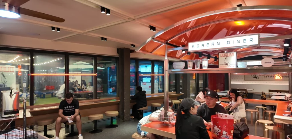 Interior of Durumi Bunsik Korean Diner at N Seoul Tower with diners enjoying bunsik meals.