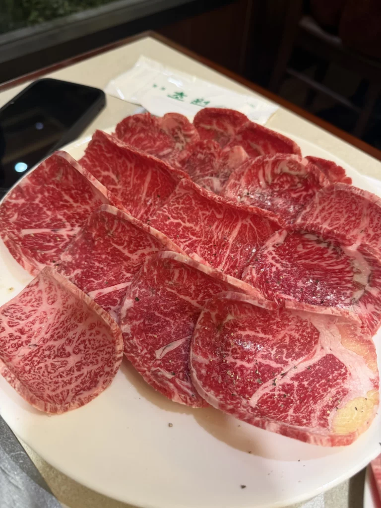 Premium marbled raw beef sirloin jumulleok at Chowon Korean BBQ in Gangnam Seoul ready for charcoal grilling.