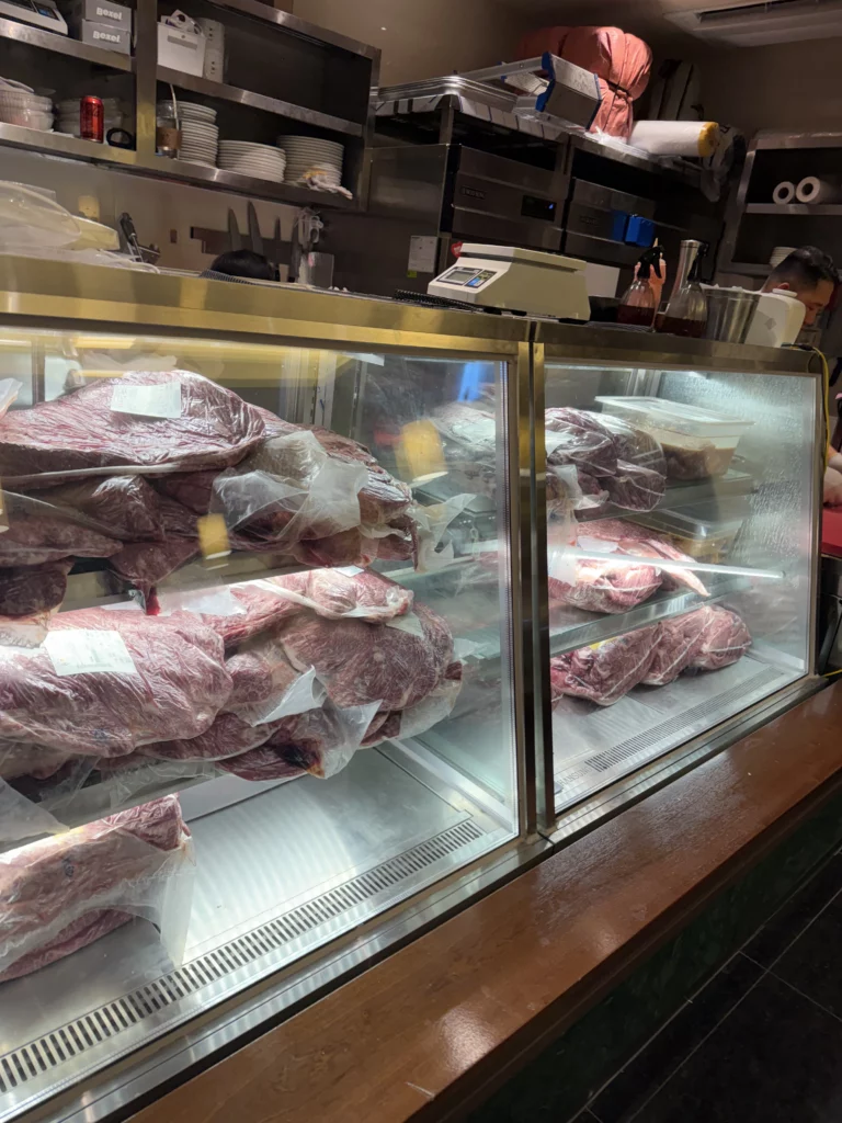 Premium beef display case with fresh marbled cuts at Chowon Korean BBQ restaurant in Gangnam Seoul for marinated sirloin jumulleok and beef tongue specialties.