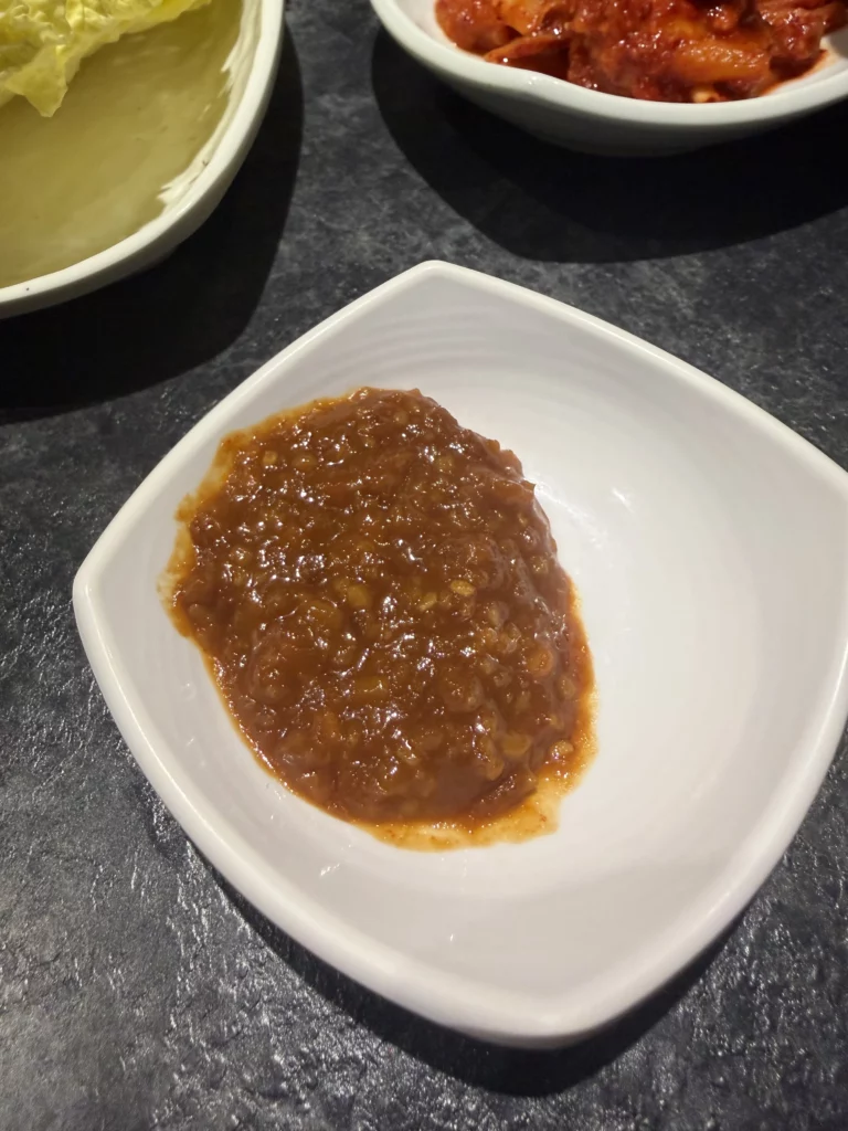 Ssamjang Korean fermented soybean and chili paste condiment for ssam wraps, traditional banchan sauce from Dam Restaurant hanjeongsik meal at Seoul Arts Center.