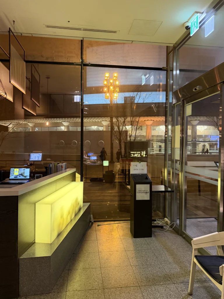 Dam Restaurant entrance with modern Korean interior and reception counter at Seoul Arts Center Calligraphy Museum, traditional hanjeongsik dining destination in Seocho-gu Seoul.