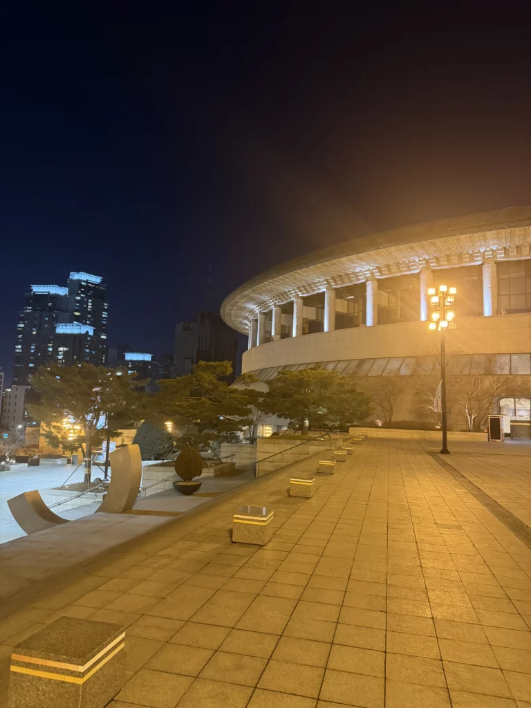 Seoul Arts Center Opera House illuminated at night with traditional Korean gat-shaped architecture, cultural complex home to Dam Restaurant for authentic hanjeongsik dining in Seocho-gu Seoul.