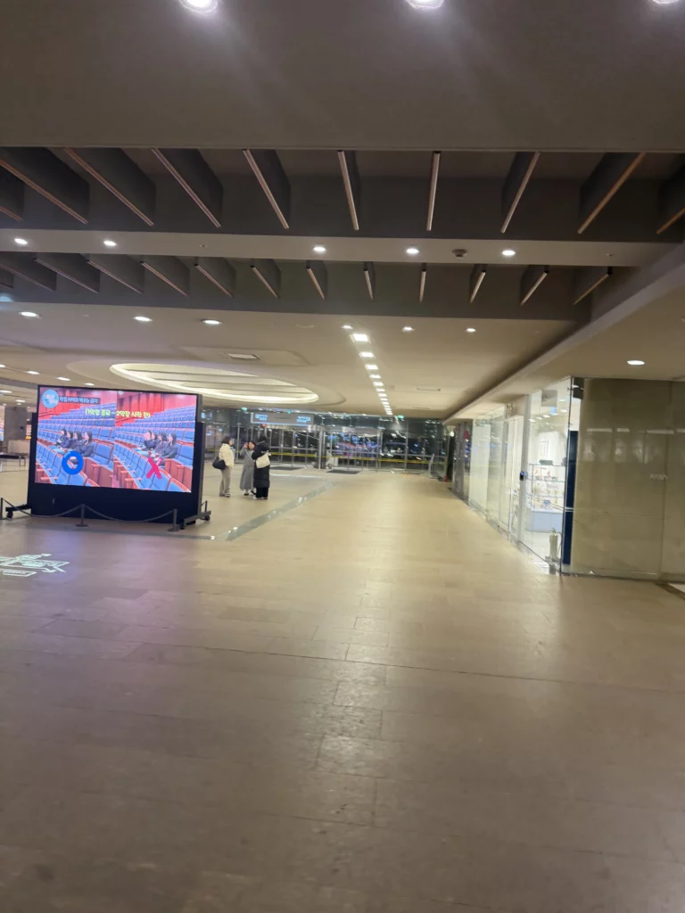 Seoul Arts Center interior lobby with modern ceiling design and digital display screen near Dam Restaurant location at Calligraphy Museum for traditional Korean hanjeongsik dining in Seocho-gu.