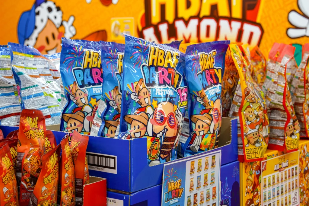 Assorted HBAF Korean flavored almond bags arranged together, showing the full range of sweet and savory varieties.