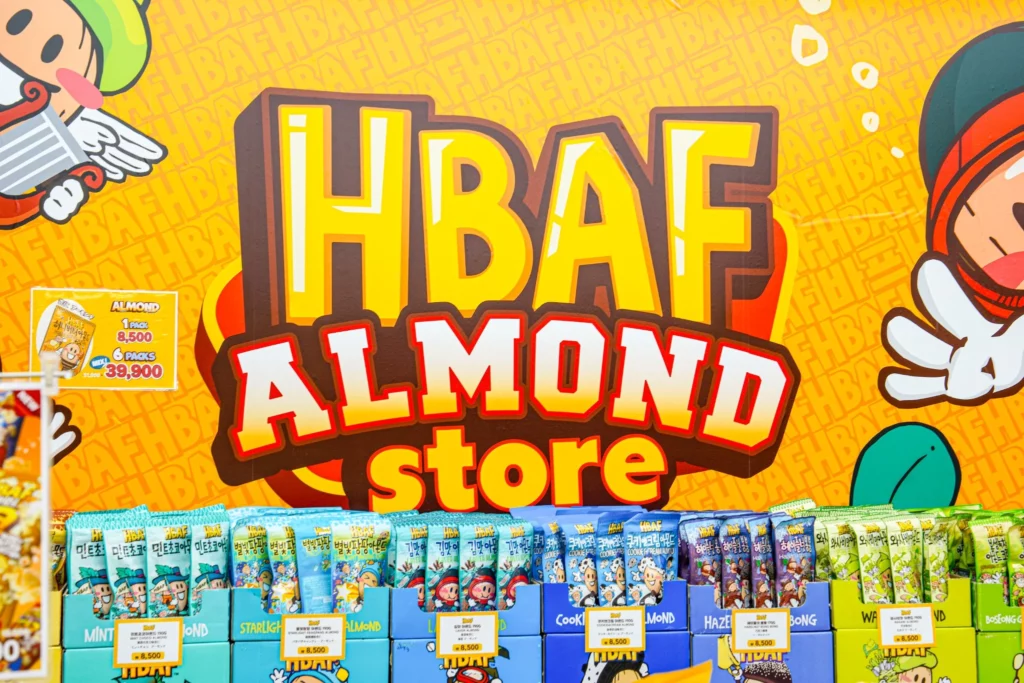 HBAF almond store at Gwangjang Market with bright yellow branded signage visible inside the historic Seoul marketplace.