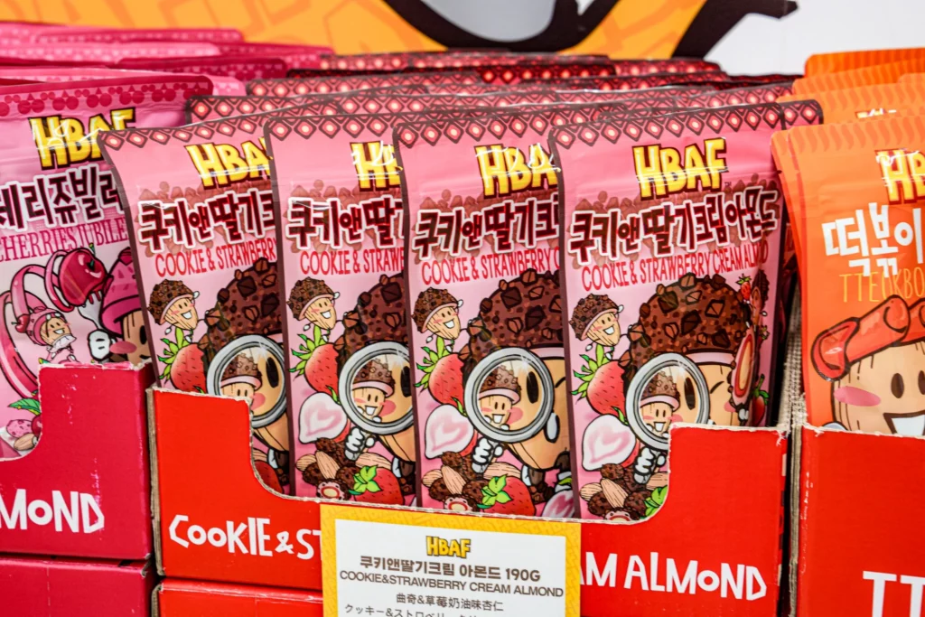 HBAF Cookie and Strawberry Cream Almond bag in pastel packaging reflecting the fruit-forward sweet flavor
