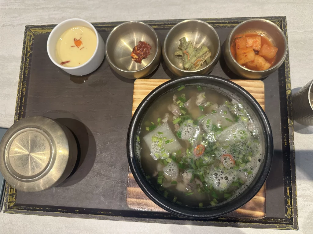A bowl of Clear Beef Soup with Korean Dropwort at an Incheon Airport Korean Restaurant