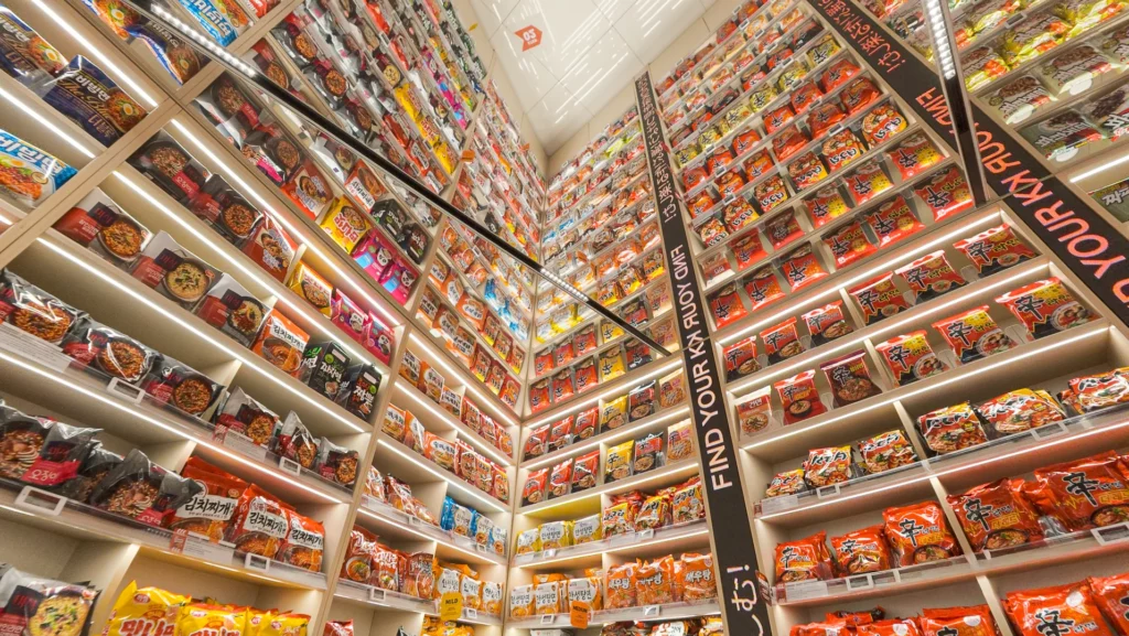 2.8-meter Ramen Archive Wall at Emart24 K-Food Lab Myeongdong stocked with 170 Korean ramyeon varieties under 