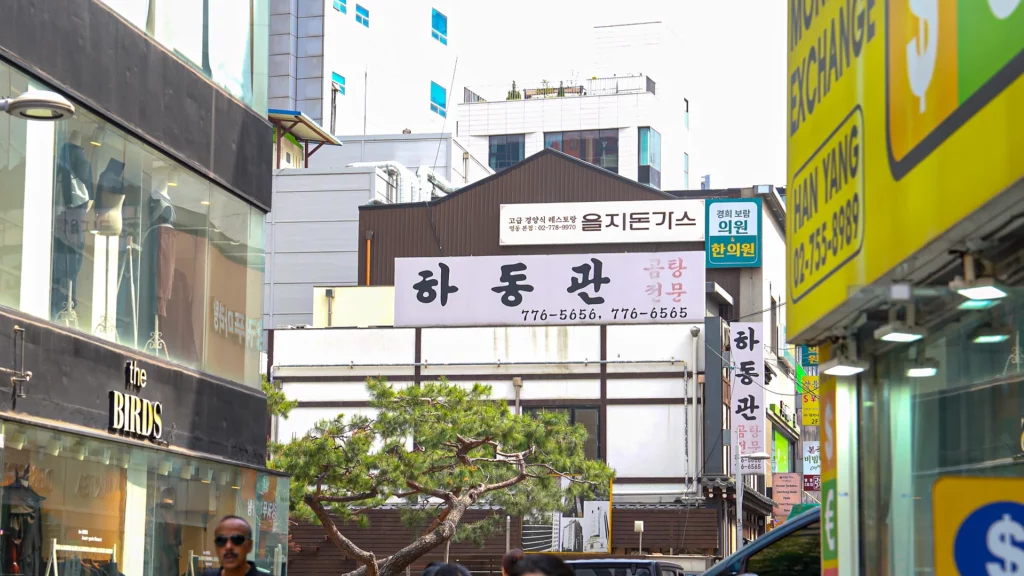 Exterior of Hadongkwan Myeongdong restaurant on a Seoul side street with Korean