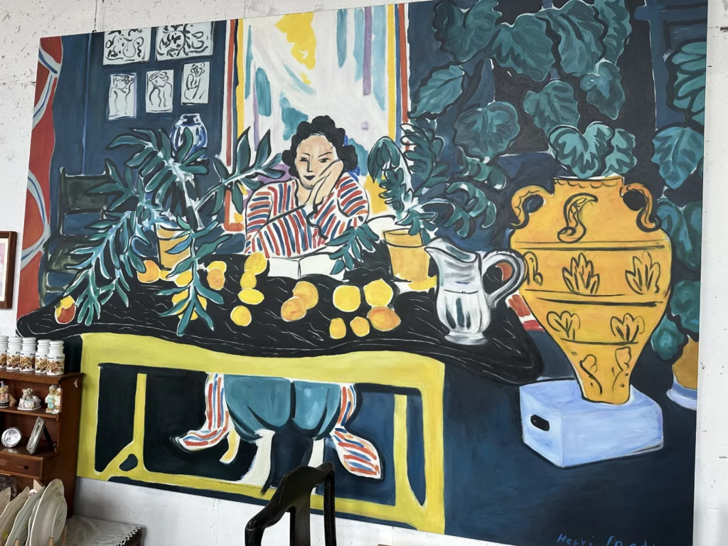 Large Henri Matisse-inspired mural decorating the interior wall of jeju brunch cafe Tangerine.