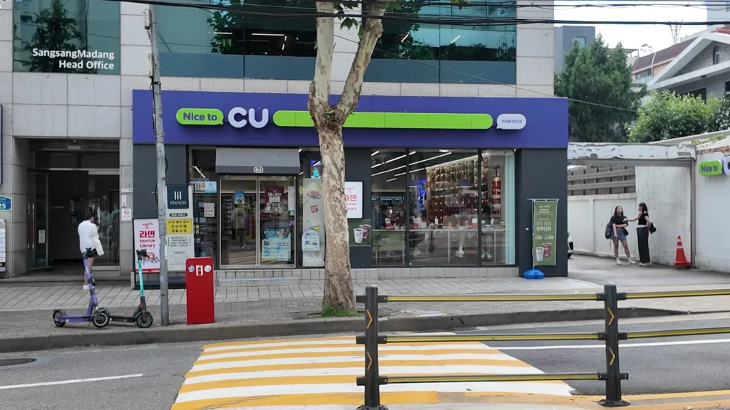 Exterior of CU Hongdae Sangsangmadang convenience store with the Ramyun Library sign displayed on the storefront, located in Mapo-gu, Seoul